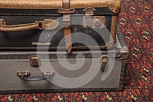 Old, retro, suitcases lie on the table with white background