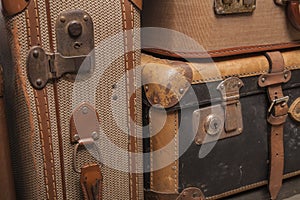 Old, retro, suitcases lie on the table with white background