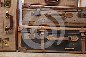 Old, retro, suitcases lie on the table with white background