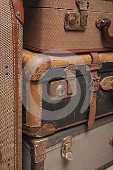 Old, retro, suitcases lie on the table with white background