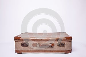 Old, retro, suitcases lie on the table with white background