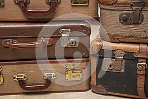 Old, retro, suitcases lie on the table with white background