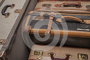 Old, retro, suitcases lie on the table with white background