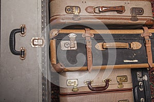 Old, retro, suitcases lie on the table with white background