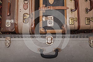 Old, retro, suitcases lie on the table with white background