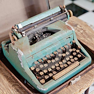 Old retro typewriter on table. Ancient printing technique in the closet