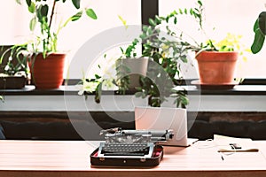 Old retro typewriter on wooden desk