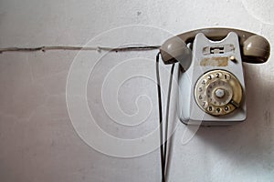 Old retro vintage rotary analogic telephone on a white background. photo