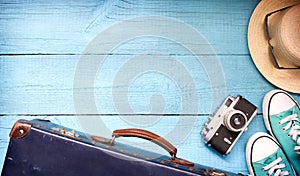 Old retro vintage suitcase and camera tourism travel background