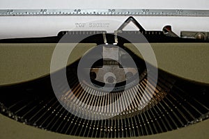 Old retro vintage typewriter. A white sheet with the printed text top secret