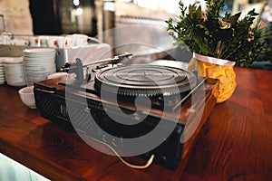 Old retro vinyl record player on the table