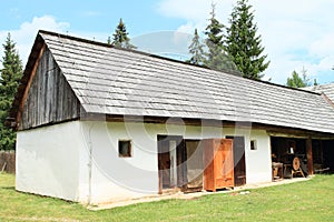 Old rich white village house with joinerÂ´s workshop