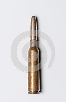 Old rifle bullet from the 1950s on white background