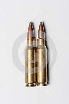 Old rifle bullets on white background