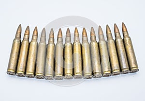 Old rifle cartridges 5.56 mm on a white background