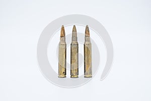 Old rifle cartridges 5.56 mm on a white background