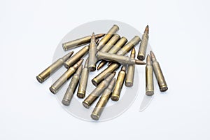 Old rifle cartridges 5.56 mm on a white background