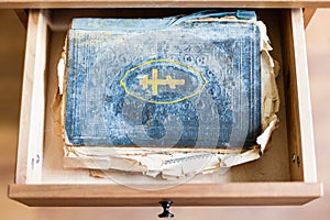 Old ritual book in open drawer