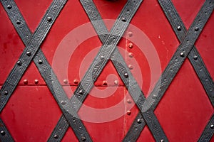 Old riveted metal red painted door