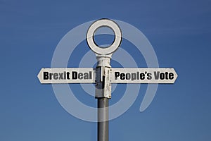 Old road sign with Brexit deal and people`s vote on opposite sides