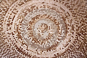 Old roman beige and brown mosaic ceramic circle pattern