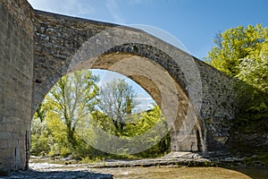 Old roman stone arch bridge Pont sur la Laye