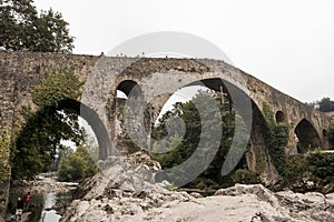 Old Roman stone bridge in Cangas de Onis over the river in Spain