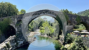 Old Roman stone bridge in Cangas de Onis. Cangas de Onis roman bridge on Sella river in Asturias of Spain