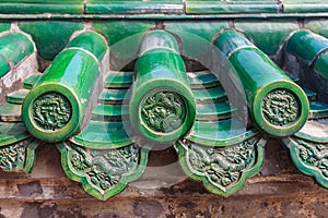 Old roof of Chinese temple with beautiful green glazed tile pattern at the Temple of Heaven in Beijing, China