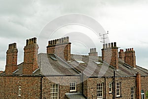 Old roof top with chimney pots on an English house. UK