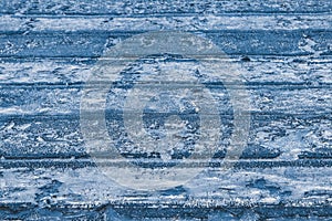 Old roofing felt material on the roof cover bitumen surface texture blue background