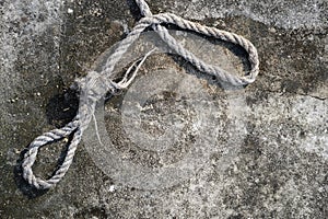 Old rope on cement floor
