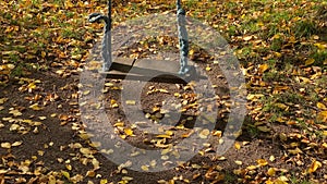 old rope swing in autumn park
