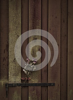 Old roses on a wooden door.