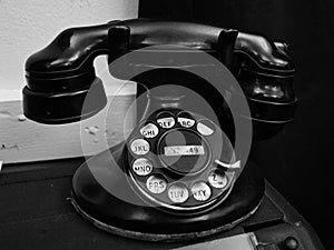 Old rotary phone in black and white