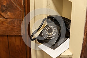 Old Rotary Phone sitting in nook in hallway