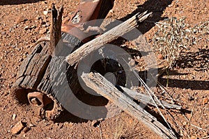 Old rotting wooden wheel with spokes and hub