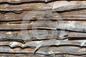 Old rough edge wood boards used as barn siding in the early morning light photo