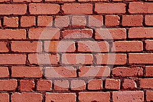 Old rough red color brick wall pattern.