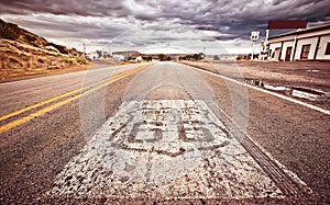 An old Route 66 shield painted on road