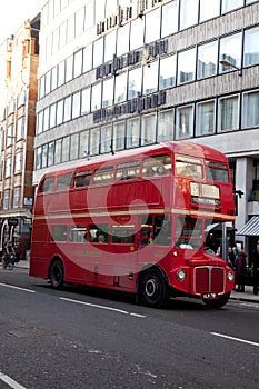 An old Routemaster London bus on the number 15 route to Tower Hill in London