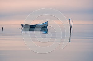 Old rowboat on the lake