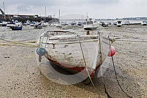 An old rowing boat on Gorey beach at low tide