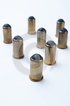 Old rubber bullets on a white background, selective focus