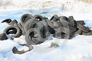 Old rubber tires on snow