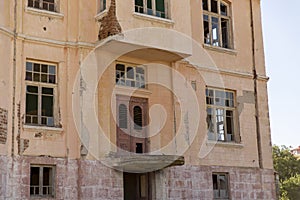 Old ruined abandoned yellow and highrise building in Ankara Turkey