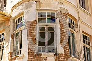 Old ruined abandoned yellow and highrise building in Ankara Turkey