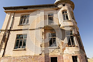 Old ruined abandoned yellow and highrise building in Ankara Turkey