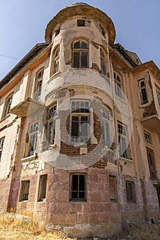 Old ruined abandoned yellow and highrise building in Ankara Turkey