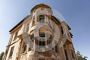 Old ruined abandoned yellow and highrise building in Ankara Turkey